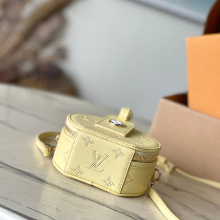 MINI BOITE CHAPEAU 13 IN BANANA YELLOW MONOGRAM PERFORATED CALFSKIN