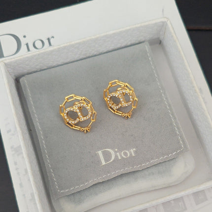CD 26S CRYSTAL CHAIN LOGO STUD EARRINGS IN GOLD TONE METAL 645589