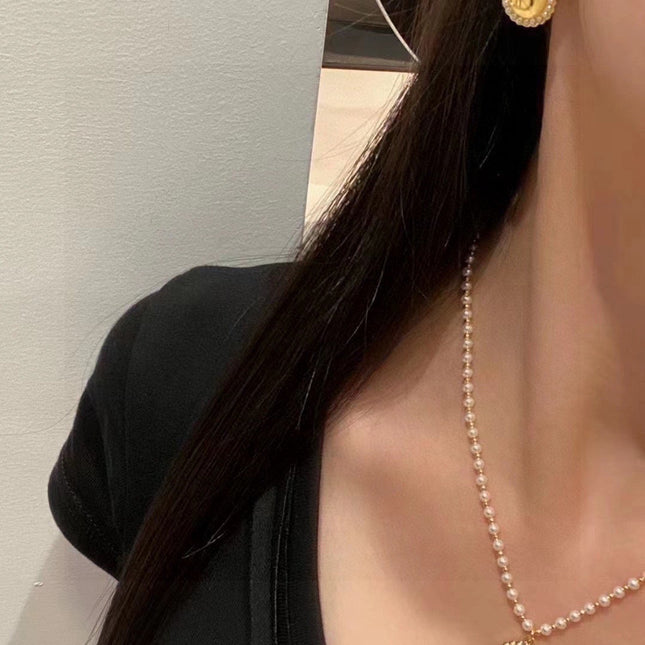 CD 26S DOUBLE PEARL MEDALLION LOGO DROP EARRINGS IN GOLD METAL