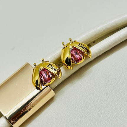 CD 26S LADYBUG PINK CRYSTAL STUD EARRINGS IN GOLD TONE METAL 644370