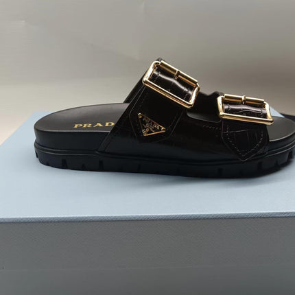 PRADA 26S STRAP SLIDES IN BLACK CROC EMBOSSED CALFSKIN GOLD HARDWARE
