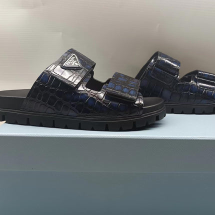 PRADA 26S STRAP SLIDES IN BLACK CROC EMBOSSED CALFSKIN