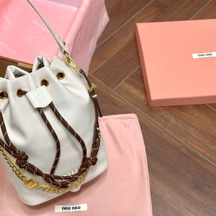 DRAWSTRING BUCKET BAG 21 IN WHITE CANVAS GOLD HARDWARE