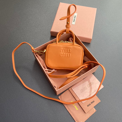 MICRO BAG KEYCHAIN 11 IN HOT CINNAMON ORANGE CALFSKIN EMBOSSED LOGO