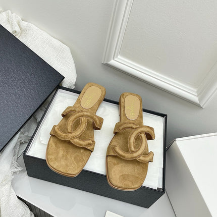 CHANEL CC LOGO MULES IN DARK BEIGE SUEDE