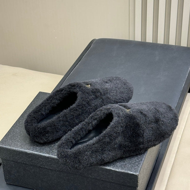 PRADA 25S CLOGS IN BLACK SHEARLING