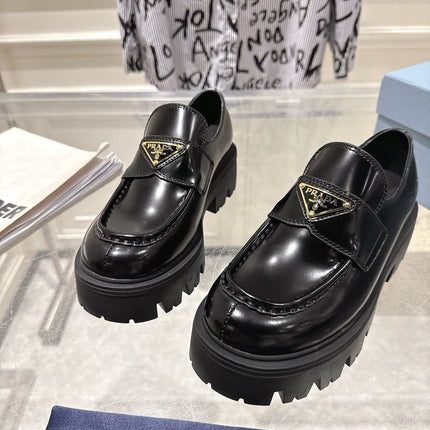 PRADA 26S PLATFORM LOAFERS 45MM IN BLACK SHINE CALFSKIN