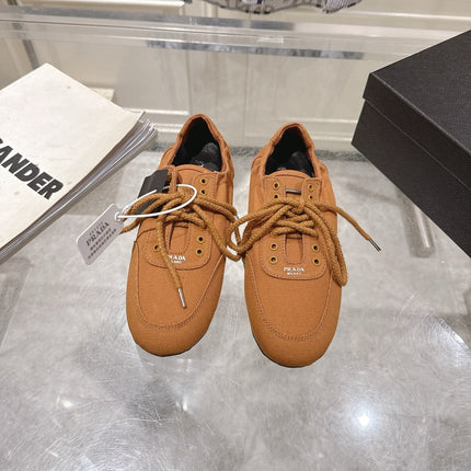 PRADA 26S COLLAPSE SNEAKERS IN CARAMEL BROWN CANVAS