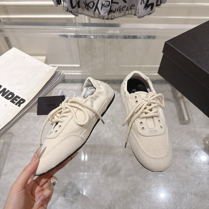 PRADA 26S COLLAPSE SNEAKERS IN WHITE CANVAS