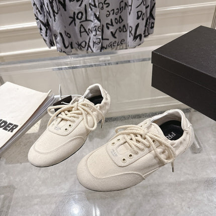 PRADA 26S COLLAPSE SNEAKERS IN WHITE CANVAS