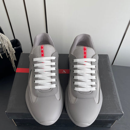 PRADA 26S AMERICA CUP SNEAKERS IN COOL GRAY SOFT RUBBER AND BIKE FABRIC