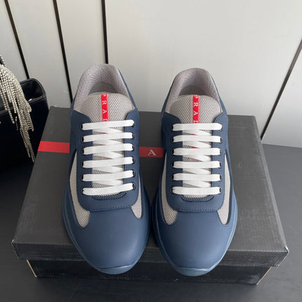 PRADA 26S AMERICA CUP SNEAKERS IN SLATE BLUE SOFT RUBBER AND BIKE FABRIC
