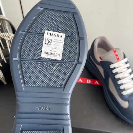 PRADA 26S AMERICA CUP SNEAKERS IN SLATE BLUE SOFT RUBBER AND BIKE FABRIC