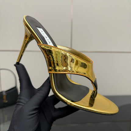 ALAIA HEELED THONG 25S IN GOLD PATENT LEATHER