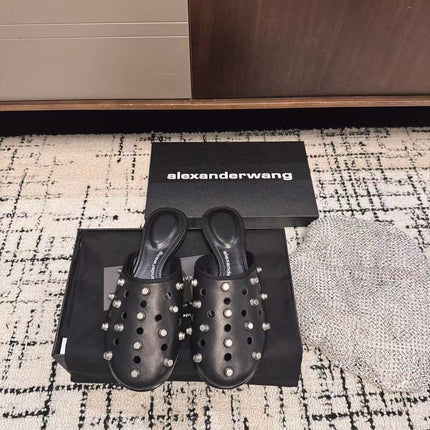 RHODES STUDDED FLAT MULE IN BLACK CALFSKIN