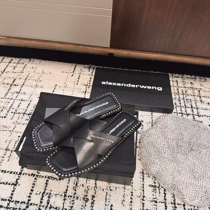 RHODES STUDDED SLIDE SANDAL IN BLACK CALFSKIN