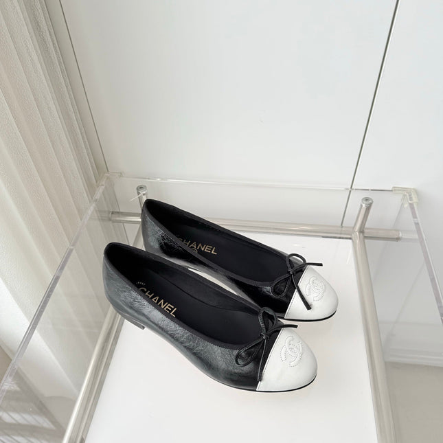 CHANEL 26S BALLET FLATS IN BLACK CRACKED CALFSKIN WITH WHITE TOE CAP AND BOW