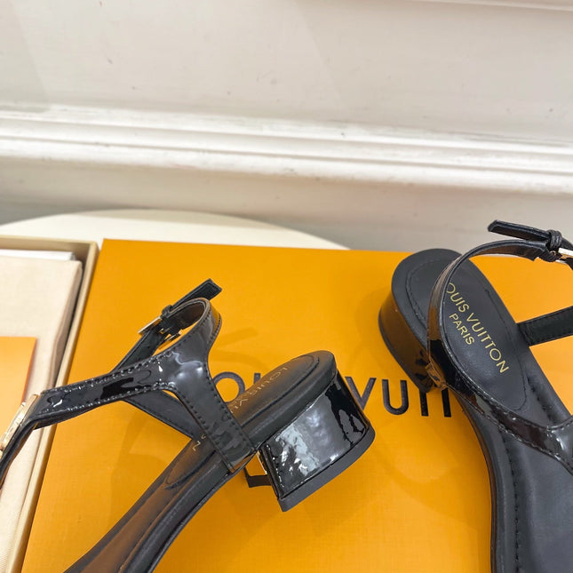 LV SUNKISS T-STRAP SANDALS IN BLACK CALFSKIN GOLD-TONE ACCESSORY.