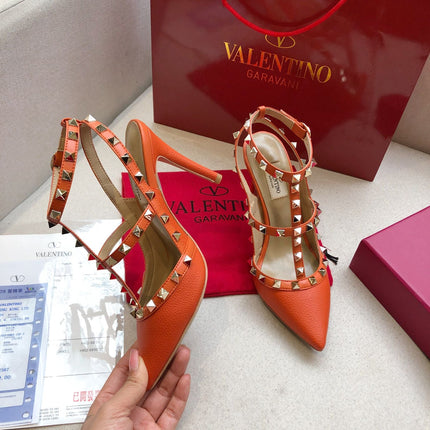 ROCKSTUD FIRE ORANGE METALLIC CALFSKIN ANKLE STRAP HIGH SANDAL
